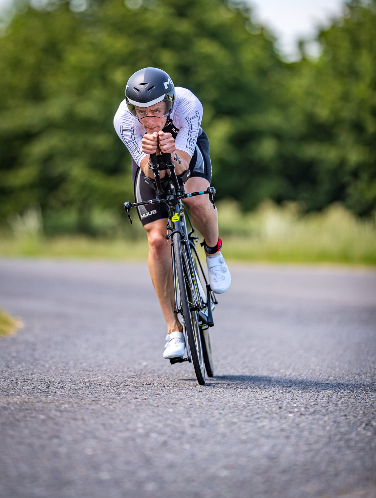 Cyclist preparing for a long ride, using endurance supplements like Fuel 5 and Hydro Sticks to optimise stamina, hydration, and performance.