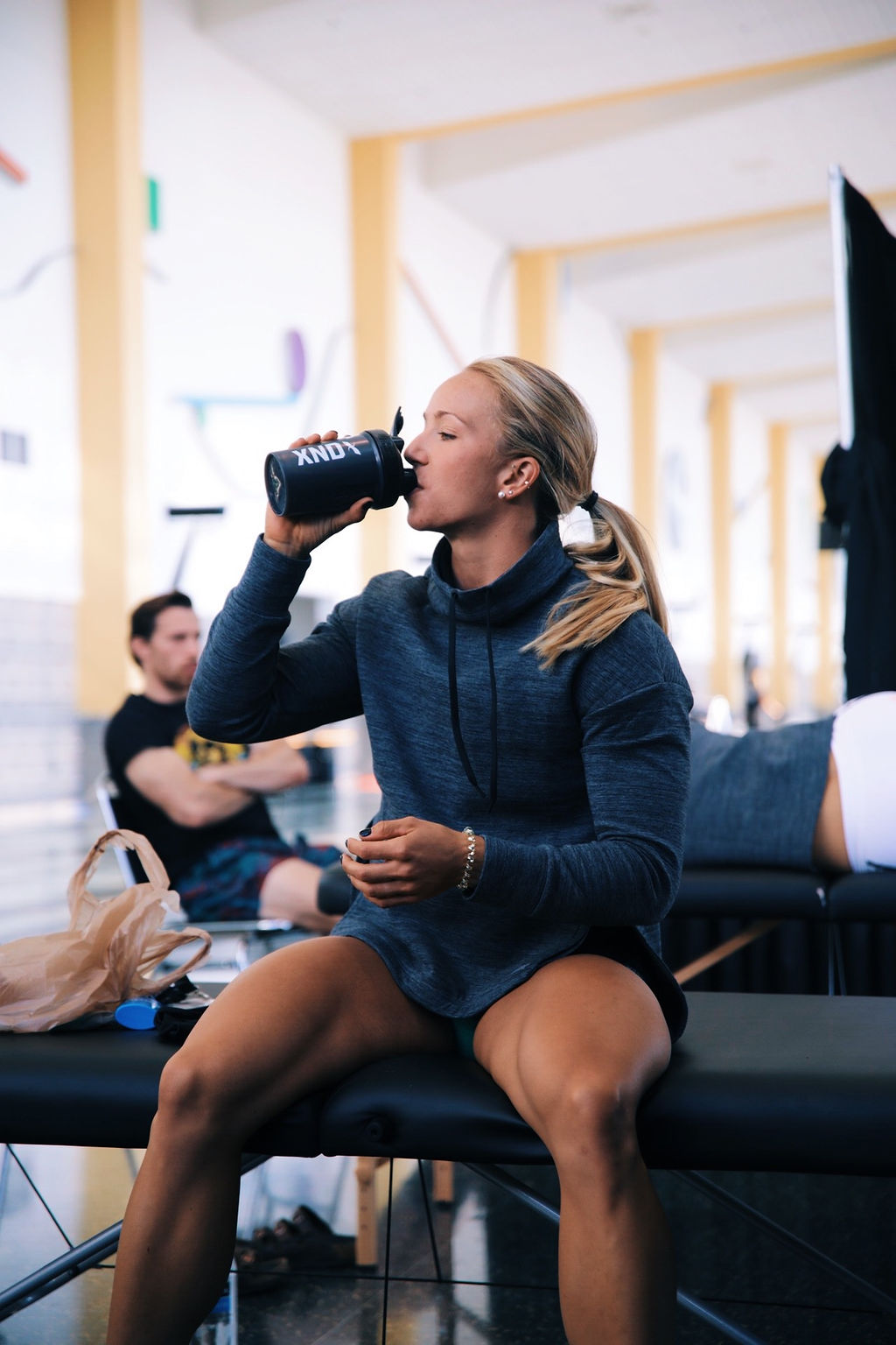 Endurance athlete using Xendurance supplements like Fuel-5, Lactic Acid Buffer, Hydro Sticks, Protein, and Energy Gels to support performance and recovery during intense training.