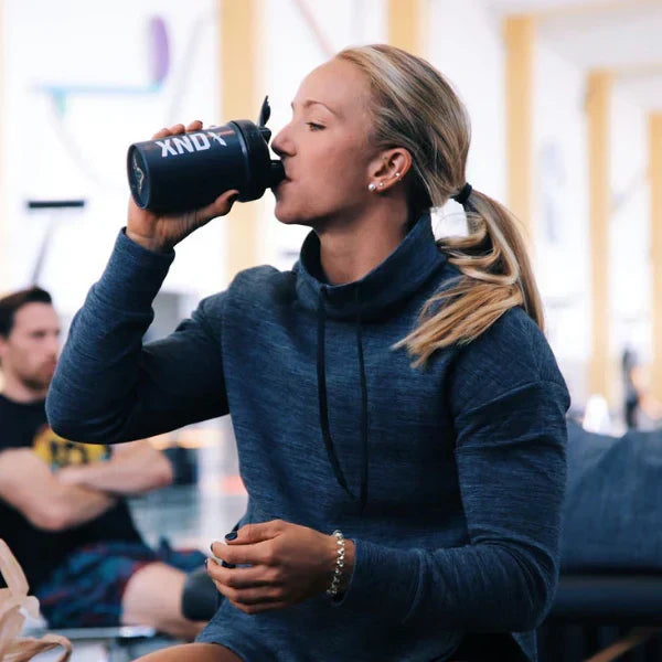 Picture of athlete drinking from a shaker