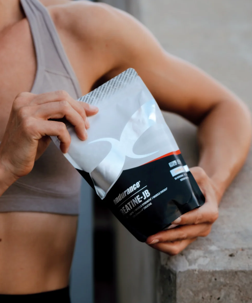 Creapure® creatine supplement bottle with scientific icons and comparison chart highlighting its purity, benefits, and effectiveness over other creatine types.